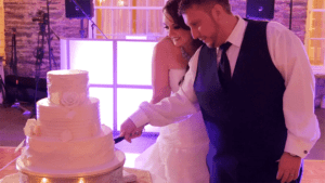 couple cuts their wedding cake